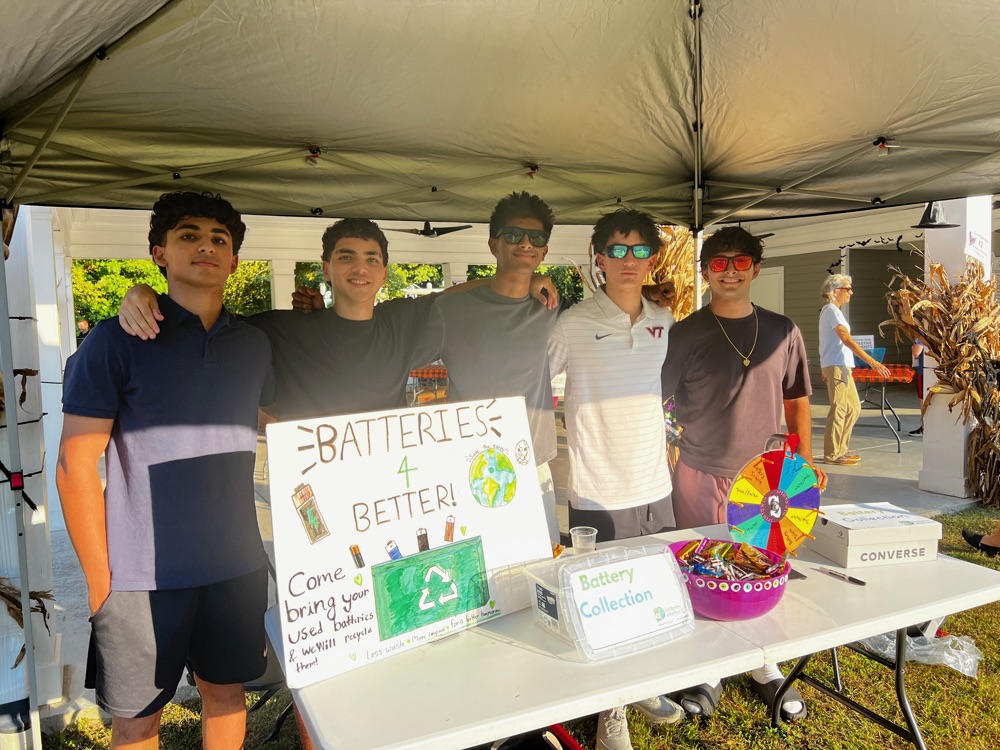 The Batteries4Better team at their booth sign