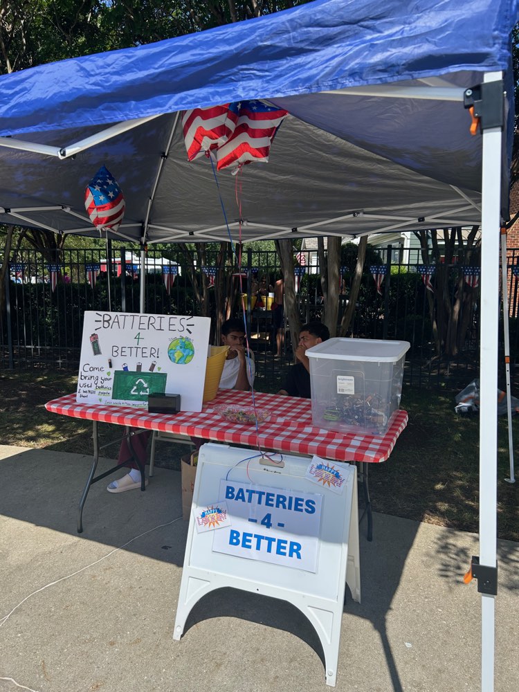 The Batteries4Better booth set up under a canopy